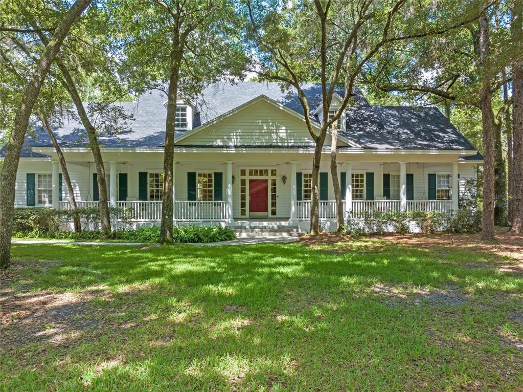 4000 Rouse Road Orlando, FL 32817 - Photo 48 of 53 front view of a house with a garden