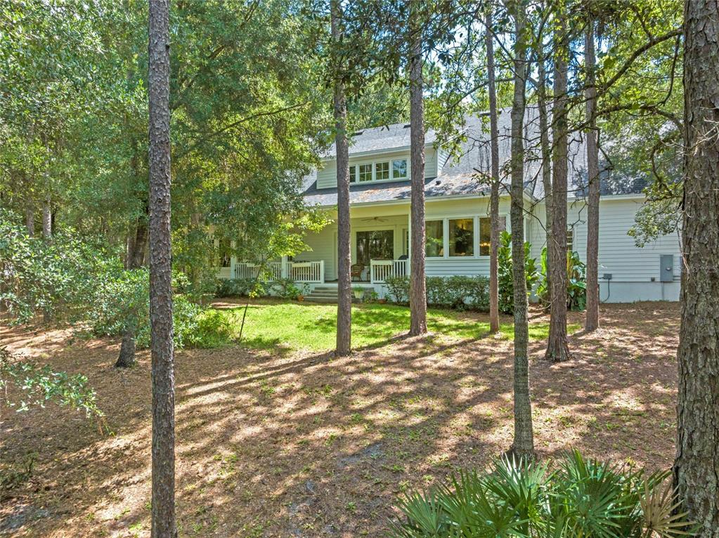 4000 Rouse Road Orlando, FL 32817 - Photo 49 of 53 a view of a house with backyard and trees