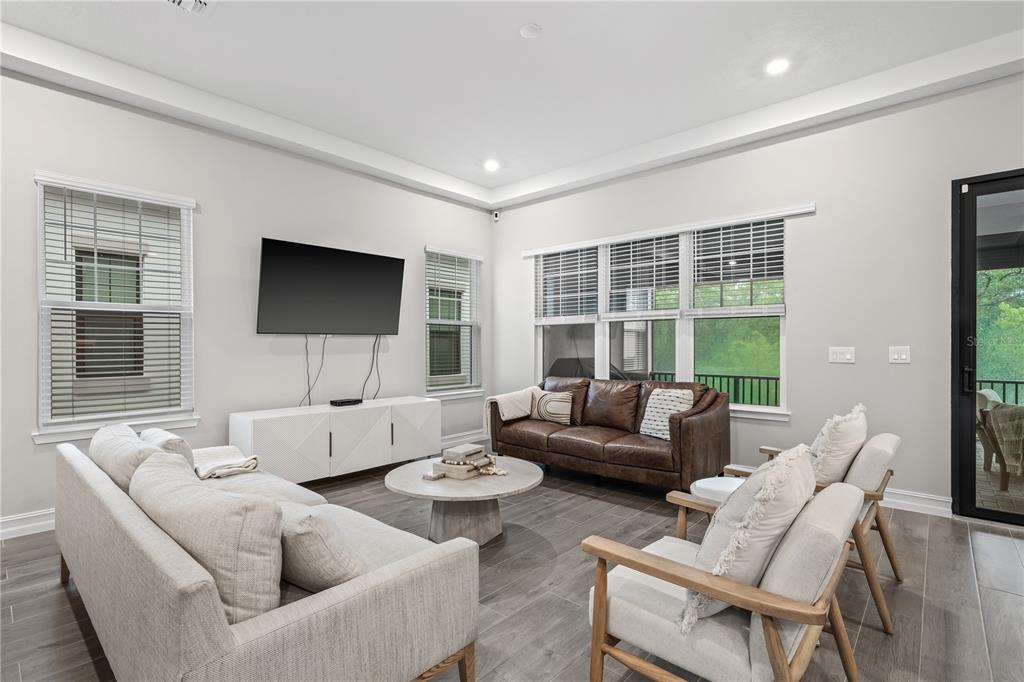 2632 Yellow Sundial Loop Ruskin, FL 33570 - Photo 11 of 52 a living room with couches and a flat screen tv