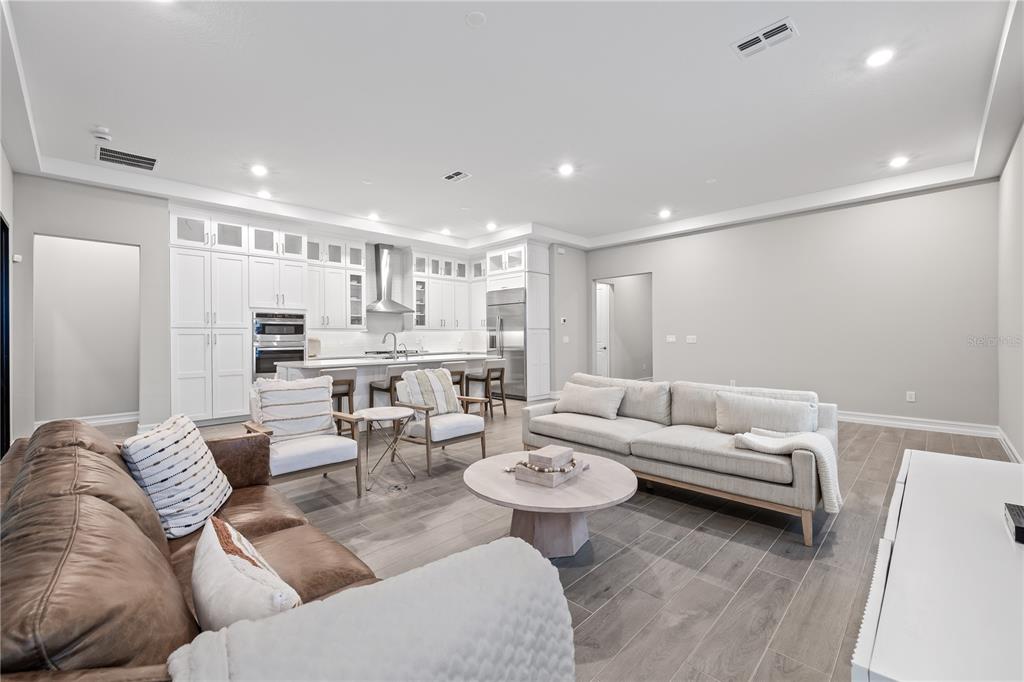 2632 Yellow Sundial Loop Ruskin, FL 33570 - Photo 13 of 52 a living room with furniture and a view of kitchen