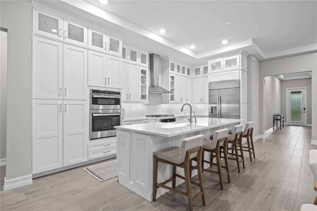 2632 Yellow Sundial Loop Ruskin, FL 33570 - Photo 14 of 52 a kitchen with appliances a sink and cabinets
