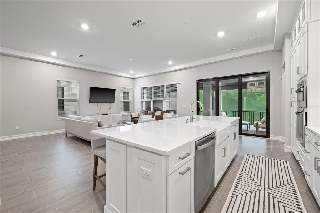 2632 Yellow Sundial Loop Ruskin, FL 33570 - Photo 17 of 52 a large white kitchen with a large window