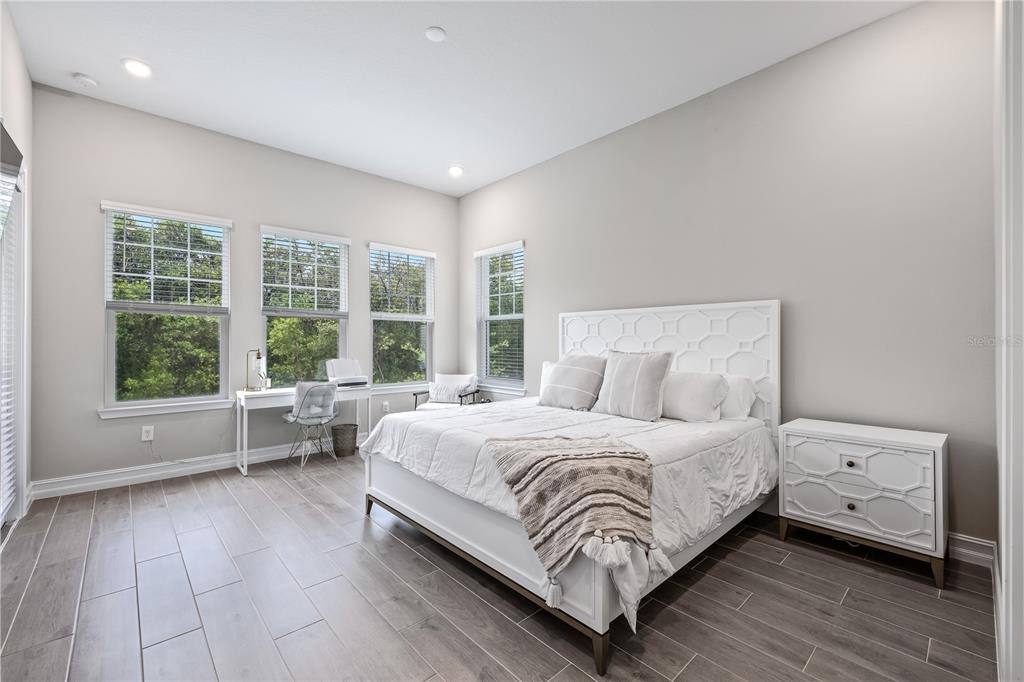 2632 Yellow Sundial Loop Ruskin, FL 33570 - Photo 23 of 52 a bedroom with a bed and a large window