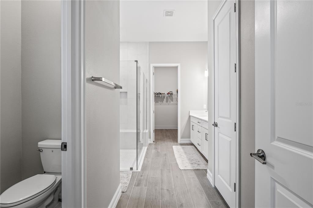 2632 Yellow Sundial Loop Ruskin, FL 33570 - Photo 26 of 52 a bathroom with a sink and toilet