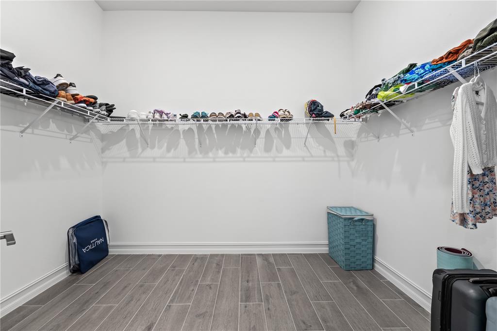 2632 Yellow Sundial Loop Ruskin, FL 33570 - Photo 31 of 52 a view of a room with shelf and wooden floor