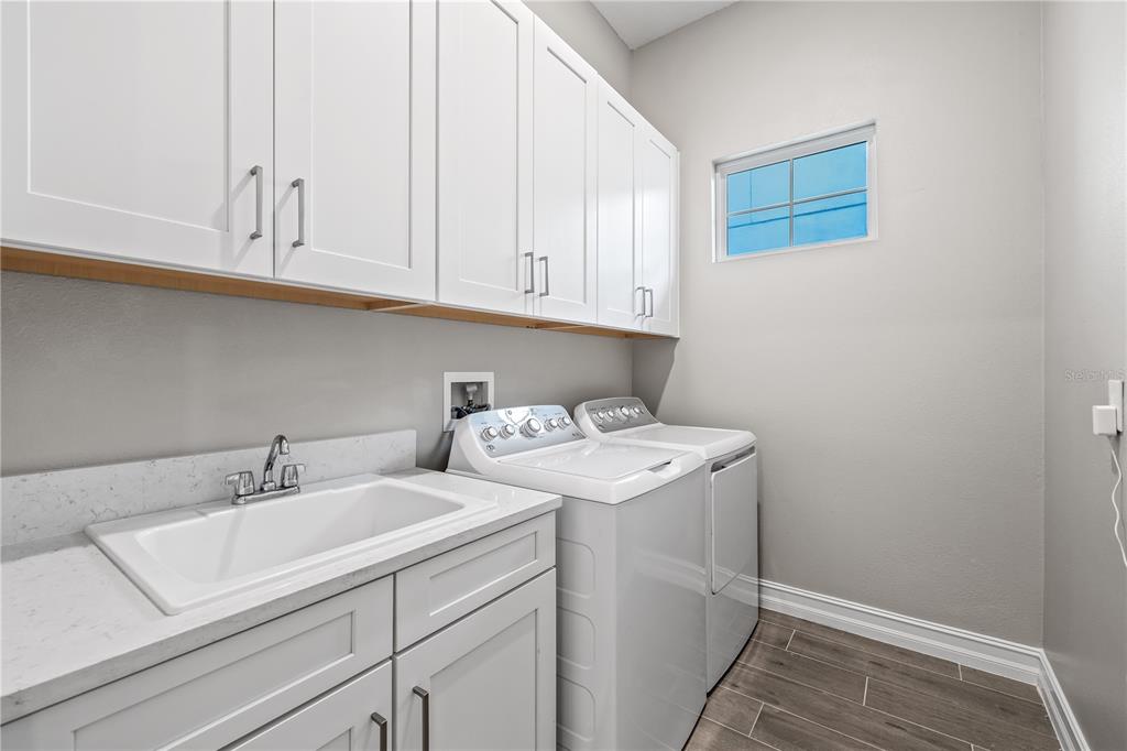 2632 Yellow Sundial Loop Ruskin, FL 33570 - Photo 38 of 52 a utility room with a sink
