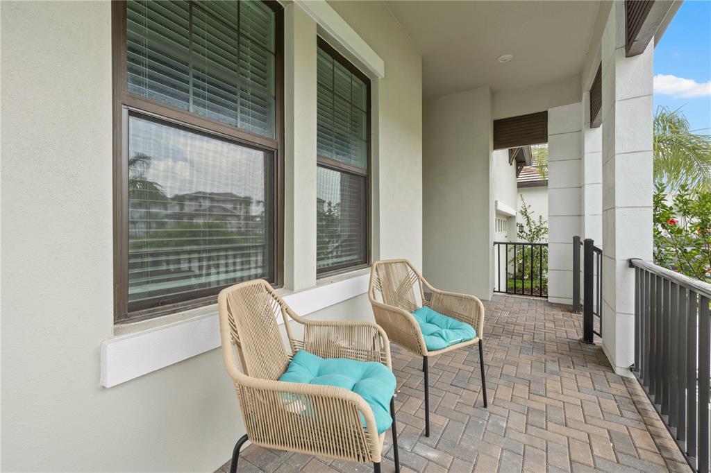 2632 Yellow Sundial Loop Ruskin, FL 33570 - Photo 6 of 52 a view of a two chair in the balcony