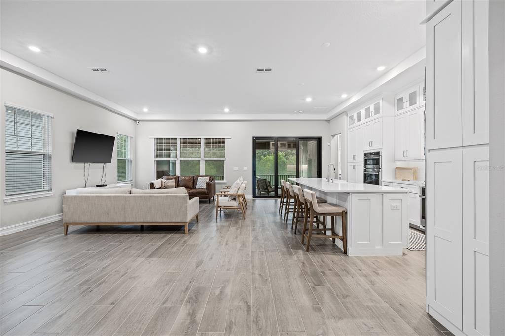 2632 Yellow Sundial Loop Ruskin, FL 33570 - Photo 8 of 52 a living room with furniture and a wooden floor