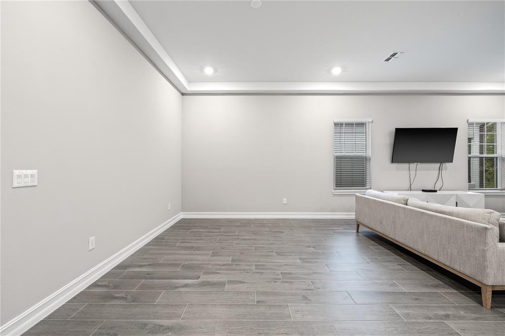 2632 Yellow Sundial Loop Ruskin, FL 33570 - Photo 9 of 52 a view of an empty room with a window and a kitchen