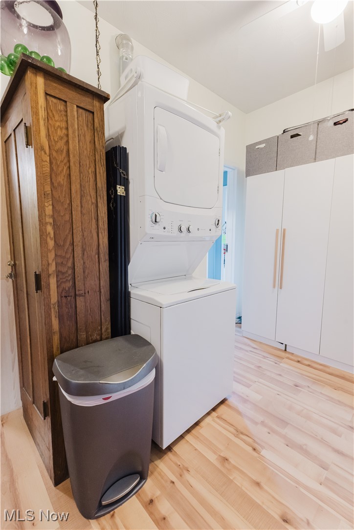 857 Archer Hill Road Colliers, WV 26035 - Photo 17 of 37 Washroom with light wood-style floors and stacked washer / dryer