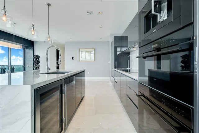 a kitchen with counter top space and stainless steel appliances