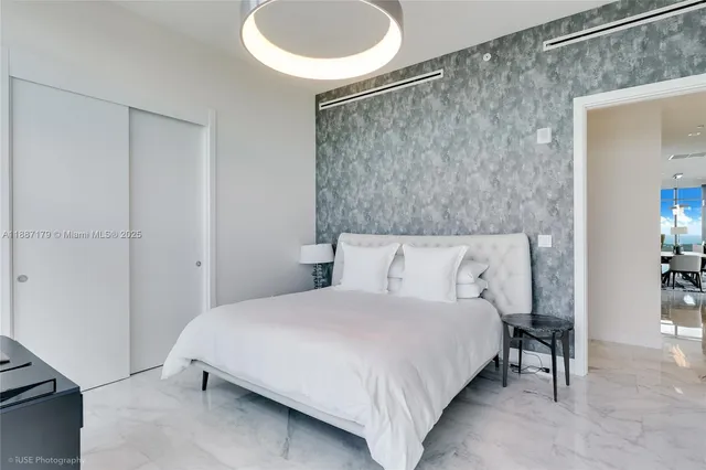 a bedroom with a bed and a table