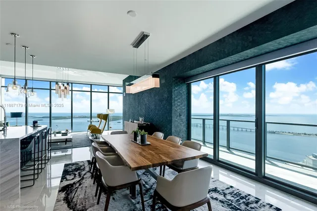 a outdoor dining space with furniture and wooden floor