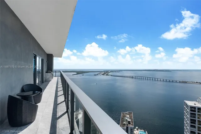 a view of balcony with furniture