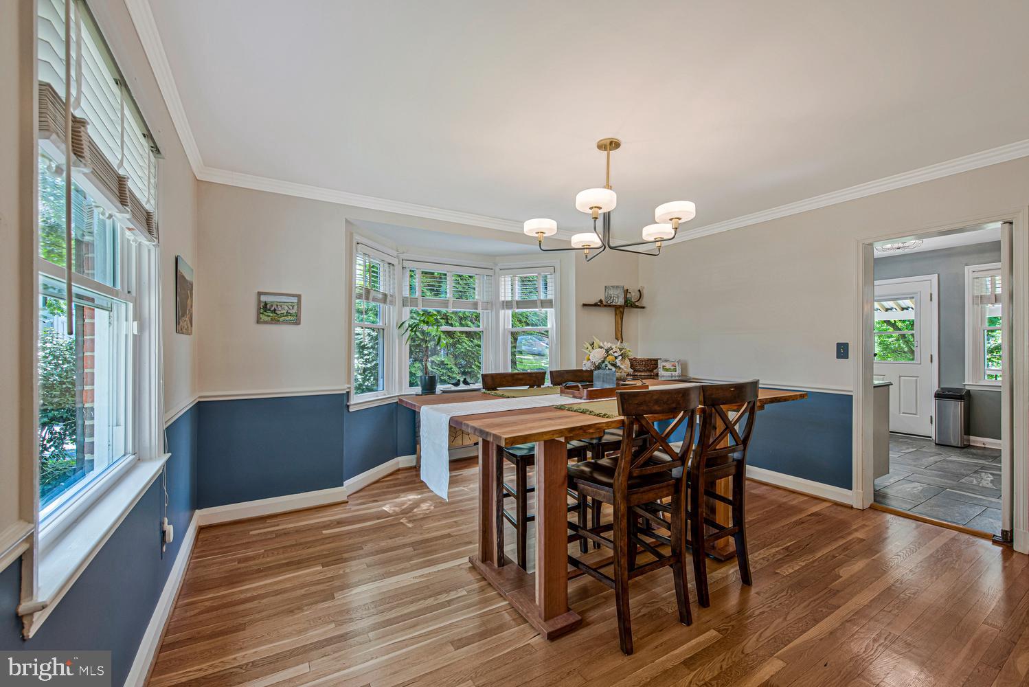 902 Locustvale Road Towson, MD 21204 - Photo 5 of 35 a view of a dining room with furniture window and wooden floor