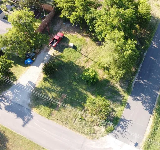a backyard of a house with a yard with outdoor seating