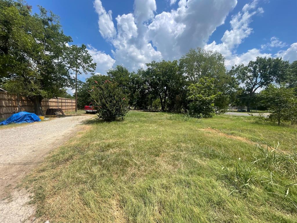 229 East 7th Street Anna, TX 75409 - Photo 5 of 7 a view of a field with trees in the background