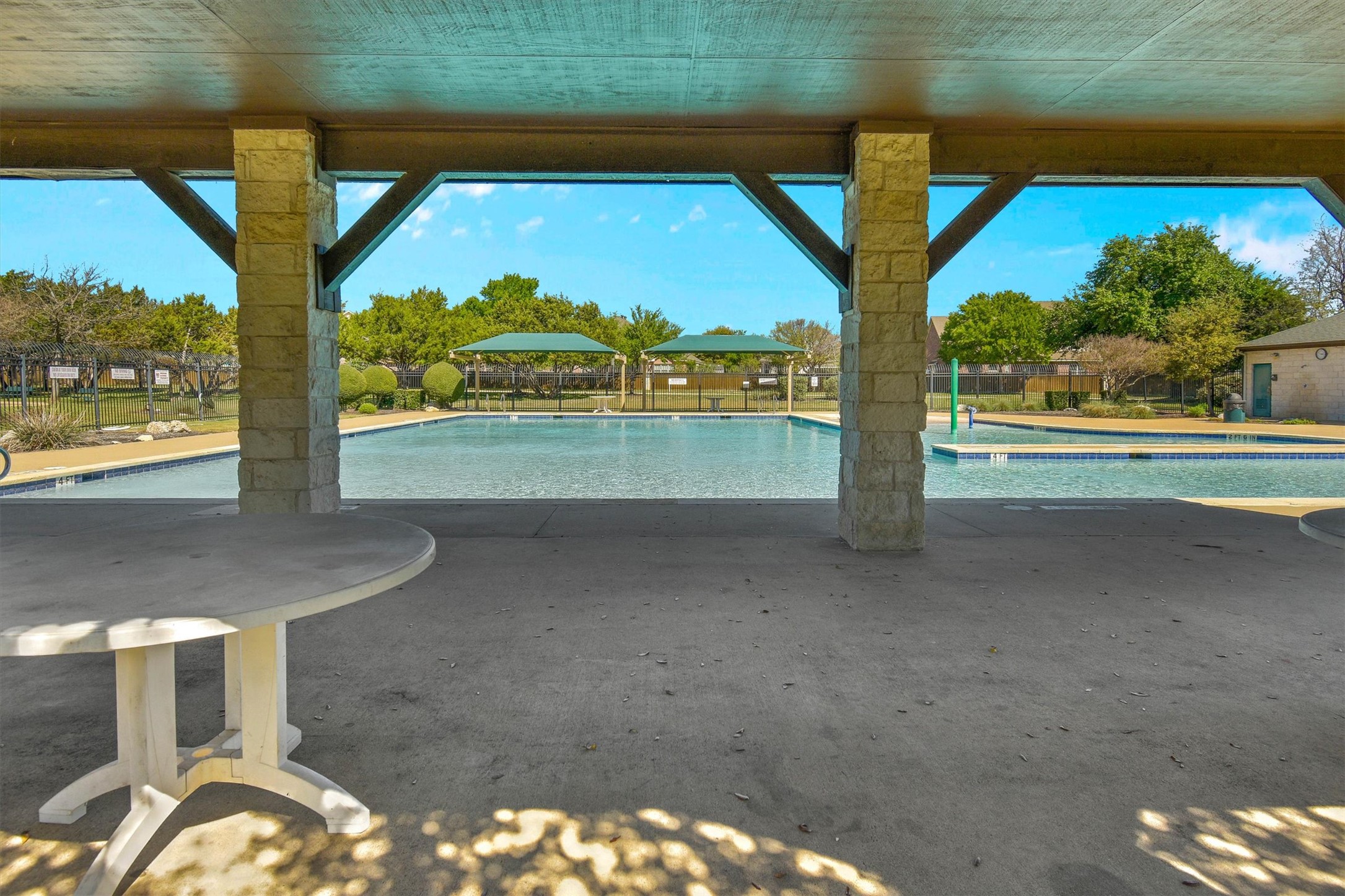 92 Verde Ranch Loop Leander, TX 78641 - Photo 30 of 37 Community pool featuring a patio area