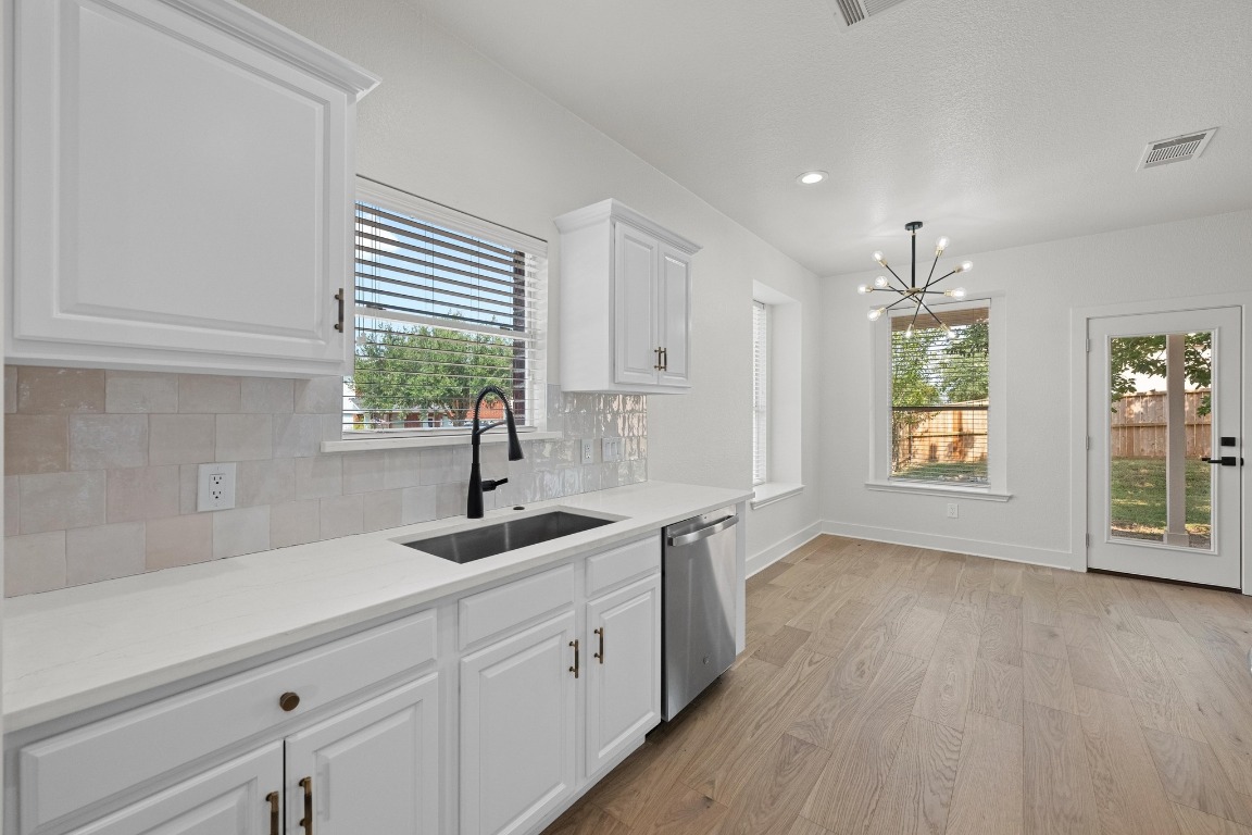 117 Waterloo Drive Kyle, TX 78640 - Photo 17 of 39 a kitchen with a sink and cabinets