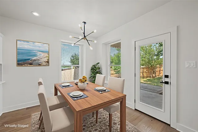 a view of a dining room with furniture window and wooden floor