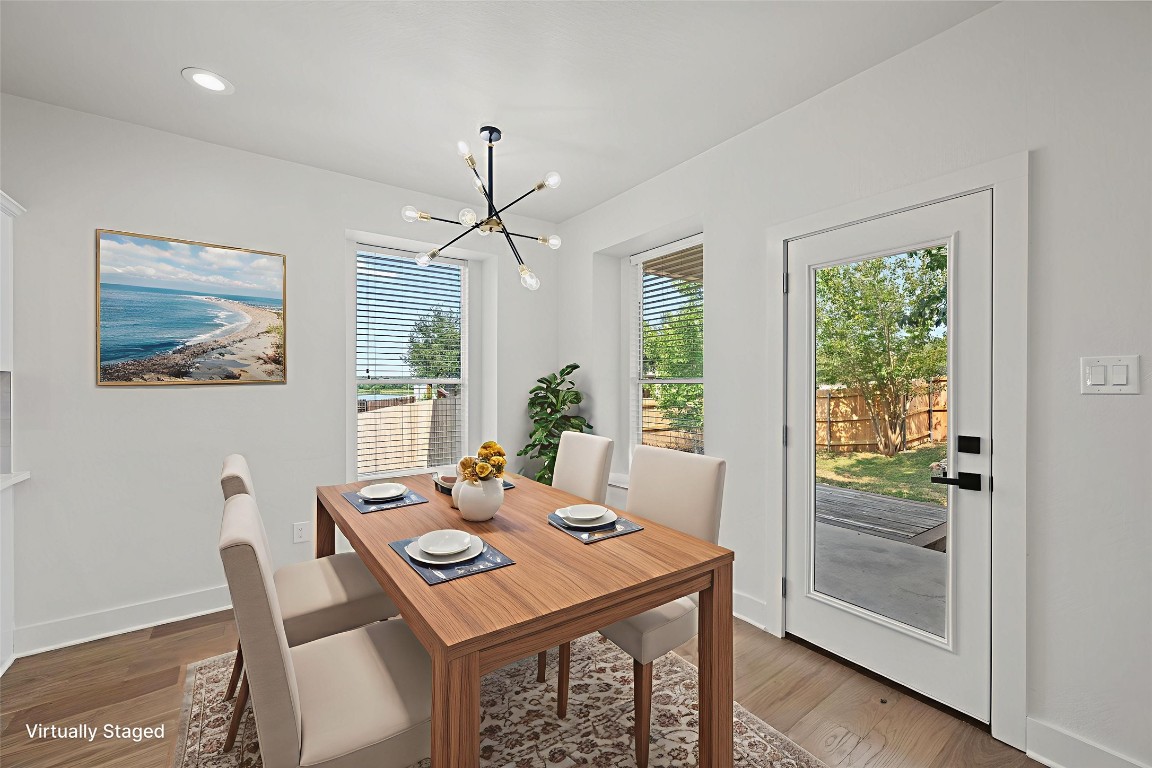 117 Waterloo Drive Kyle, TX 78640 - Photo 19 of 39 a view of a dining room with furniture window and wooden floor