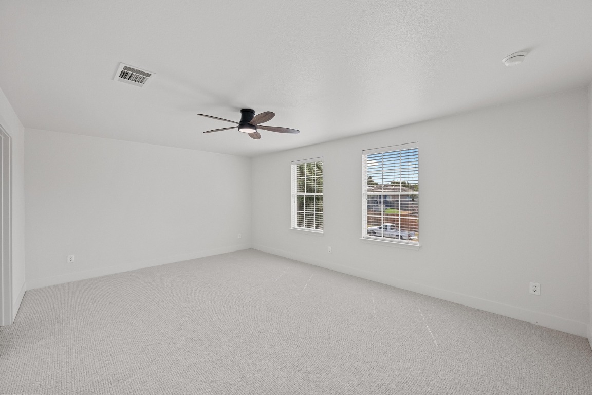 117 Waterloo Drive Kyle, TX 78640 - Photo 22 of 39 a view of an empty room with a window
