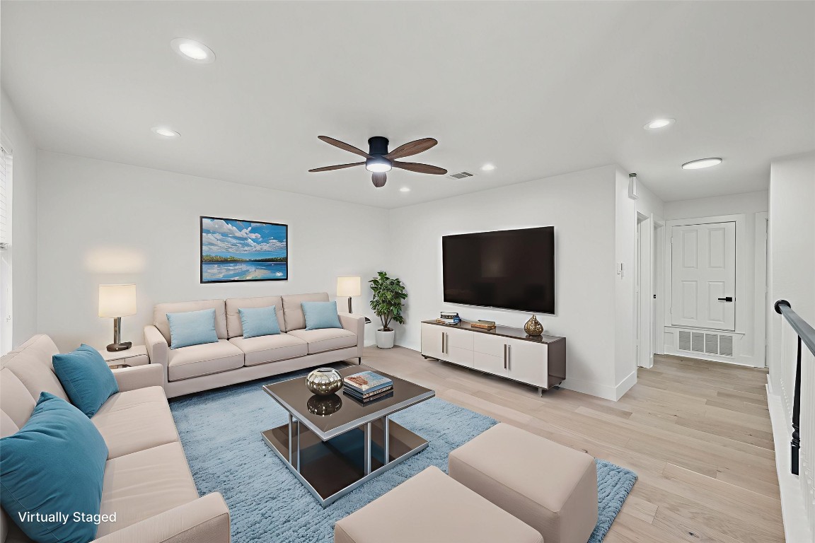 117 Waterloo Drive Kyle, TX 78640 - Photo 26 of 39 a living room with furniture and a flat screen tv