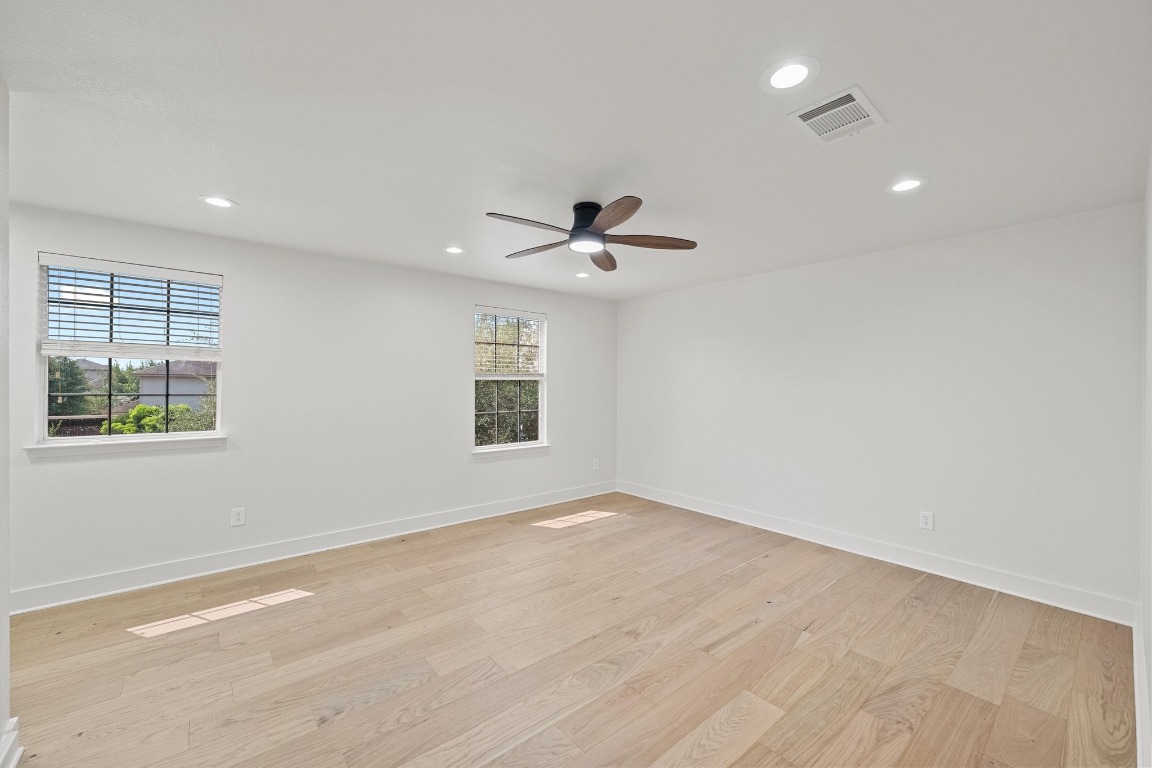 117 Waterloo Drive Kyle, TX 78640 - Photo 28 of 39 an empty room with a window and a ceiling fan