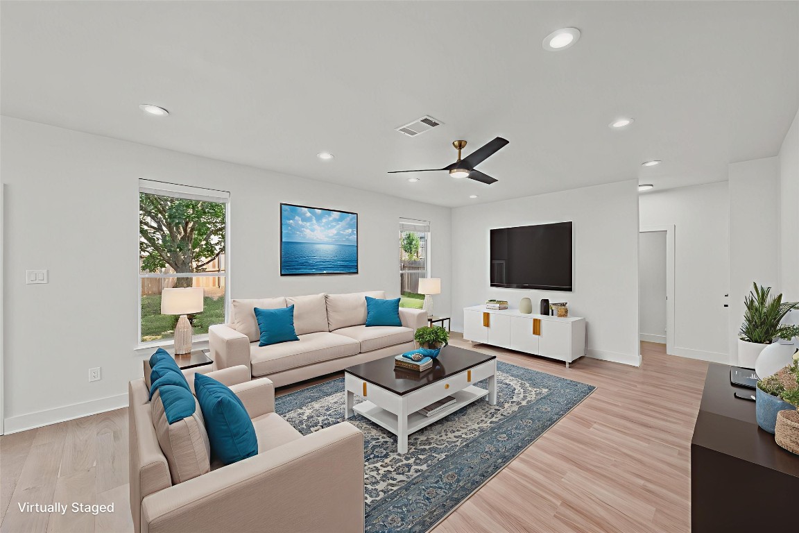 117 Waterloo Drive Kyle, TX 78640 - Photo 3 of 39 a living room with furniture and a flat screen tv