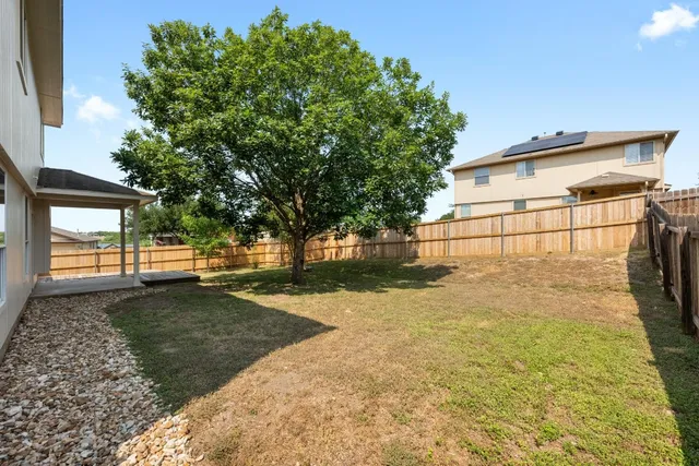 a view of a lake with a yard