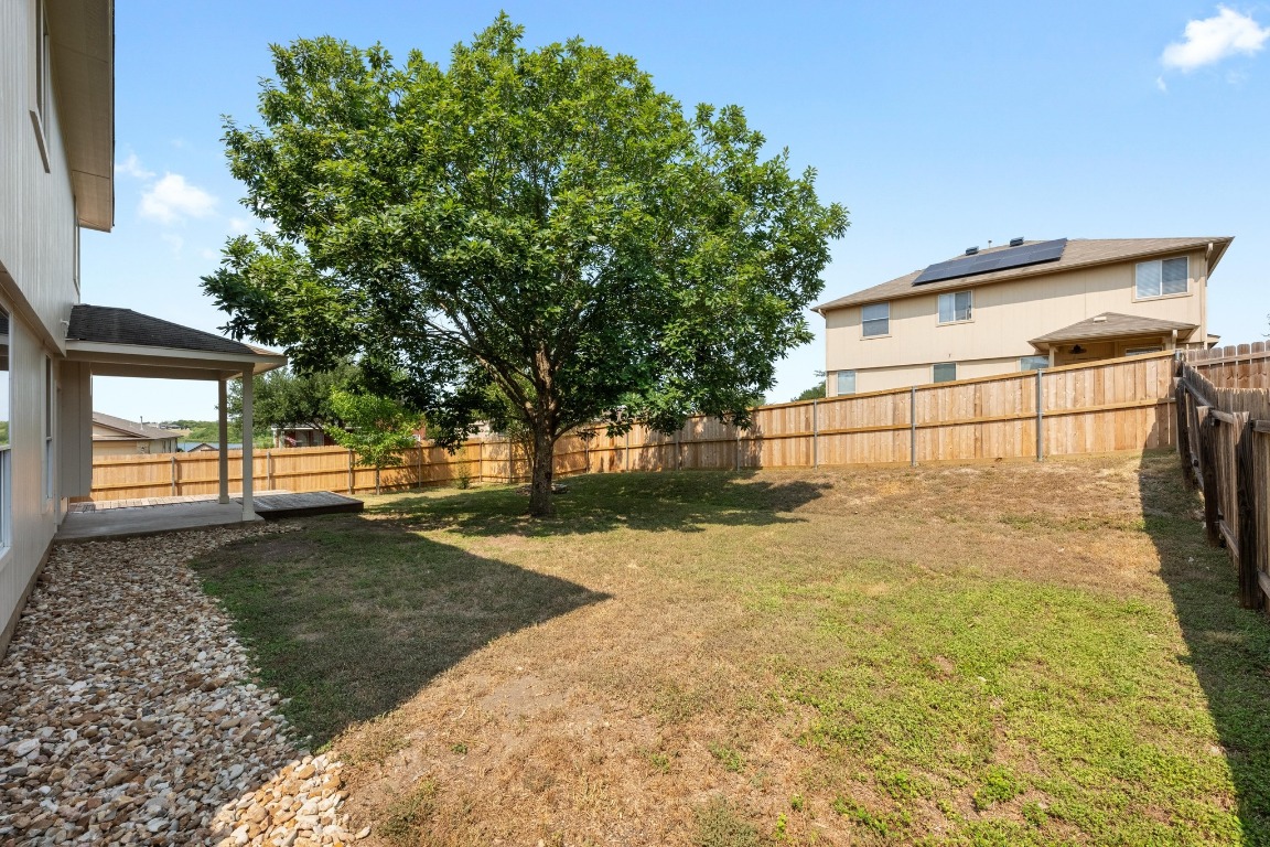 117 Waterloo Drive Kyle, TX 78640 - Photo 36 of 39 a backyard of a house with lots of green space