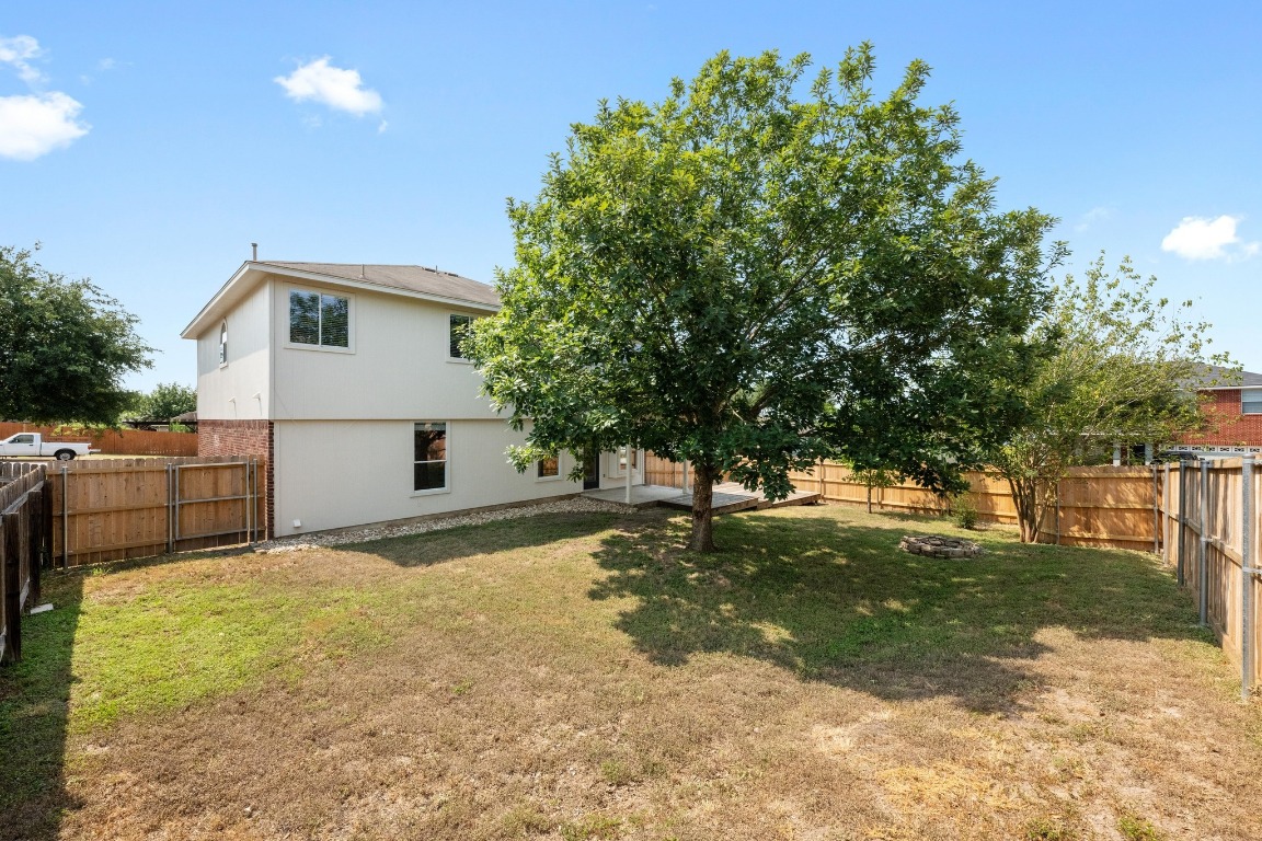 117 Waterloo Drive Kyle, TX 78640 - Photo 37 of 39 a view of a yard in front of a house with a large tree