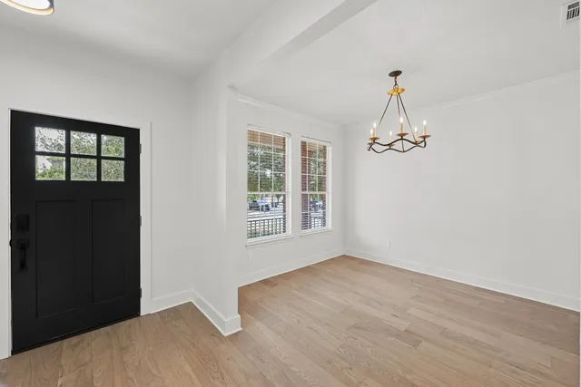 a view of empty room with windows