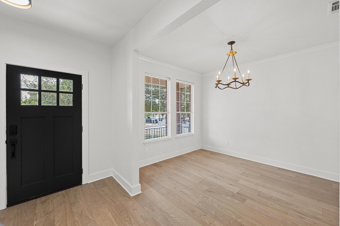 117 Waterloo Drive Kyle, TX 78640 - Photo 10 of 39 a view of empty room with windows