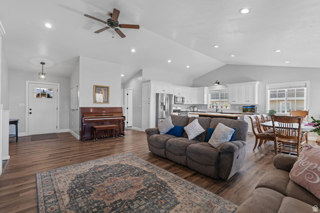 75 North 100th Street West Fillmore, UT 84631 - Photo 9 of 62 Living room featuring vaulted ceiling, dark wood-type flooring, ceiling fan, and recessed lighting
