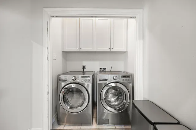 a view of storage and utility room with washer and dryer