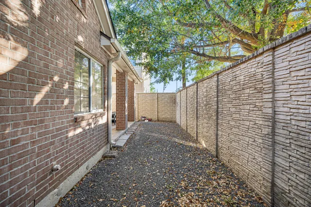 a view of a backyard with pathway