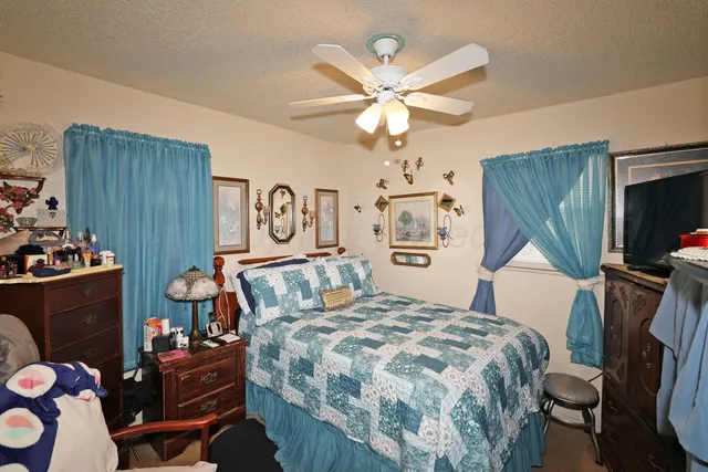 a bedroom with a bed and furniture