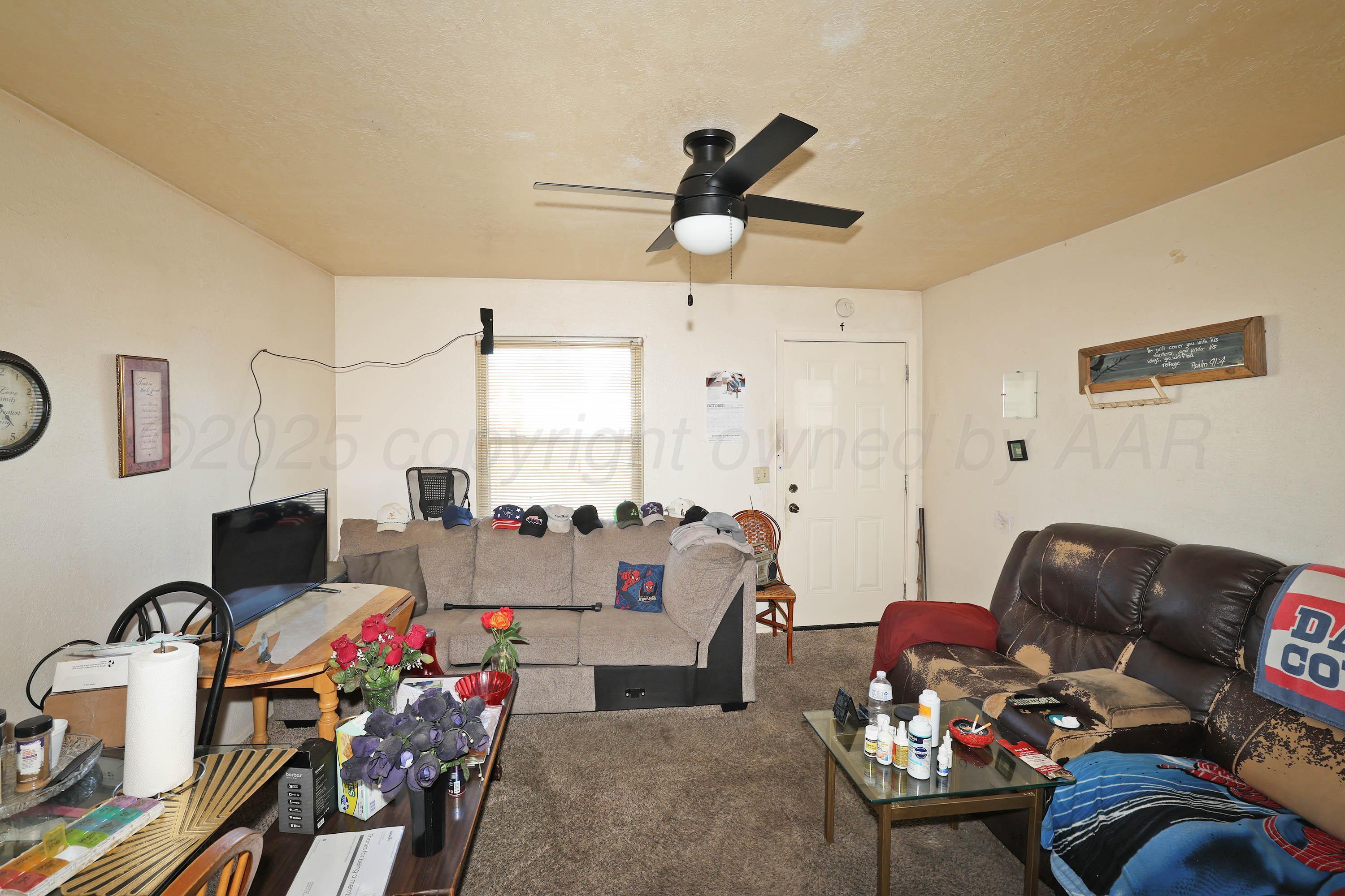 90 North Tennessee Street Amarillo, TX 79106 - Photo 15 of 22 a living room with furniture and a window
