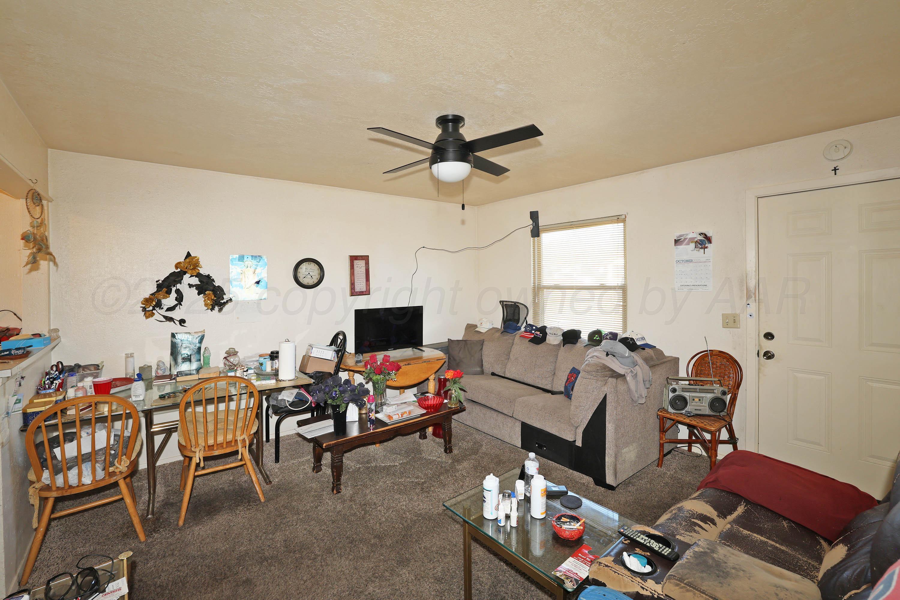 90 North Tennessee Street Amarillo, TX 79106 - Photo 16 of 22 a living room with furniture and a flat screen tv