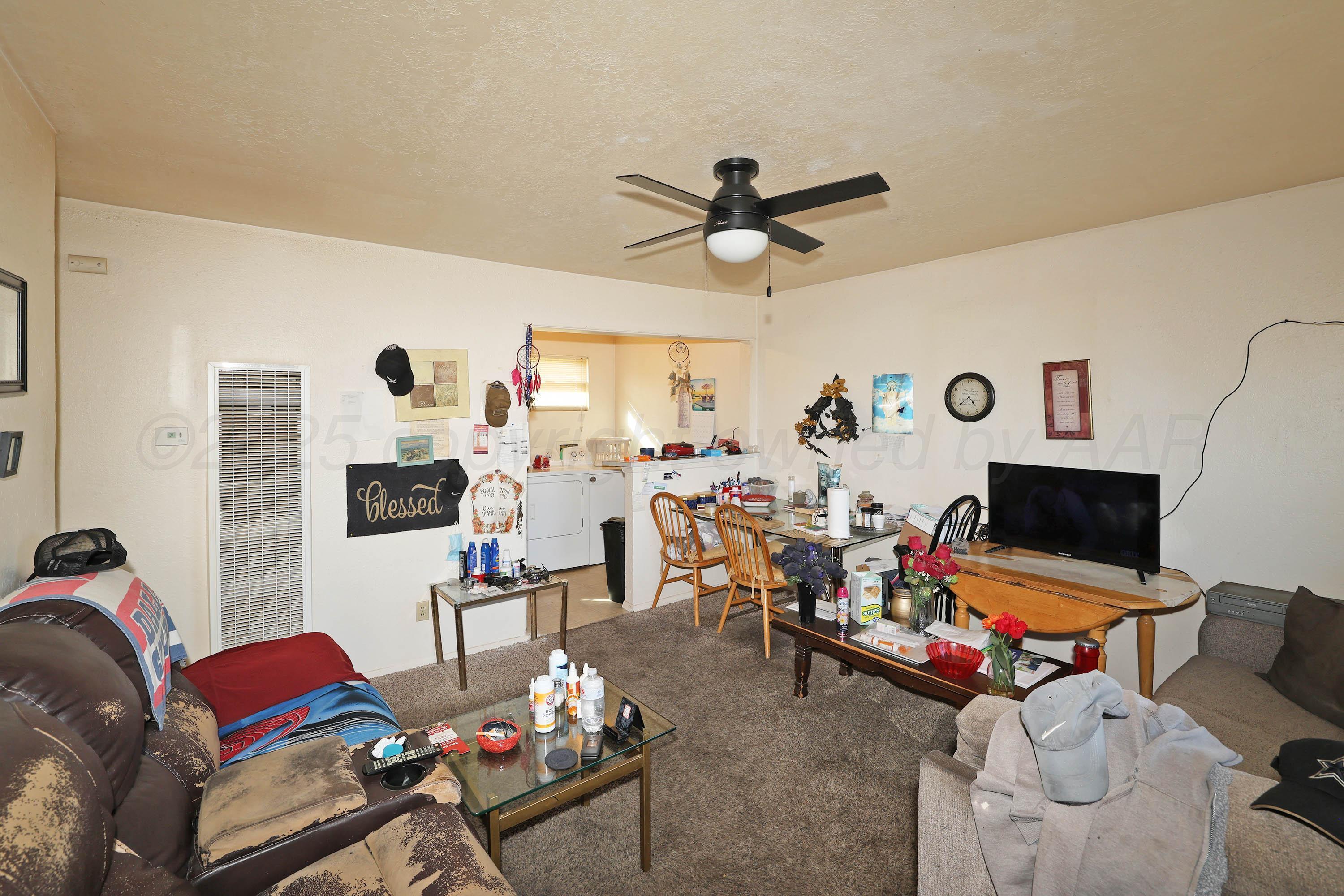 90 North Tennessee Street Amarillo, TX 79106 - Photo 17 of 22 a living room with furniture and a flat screen tv