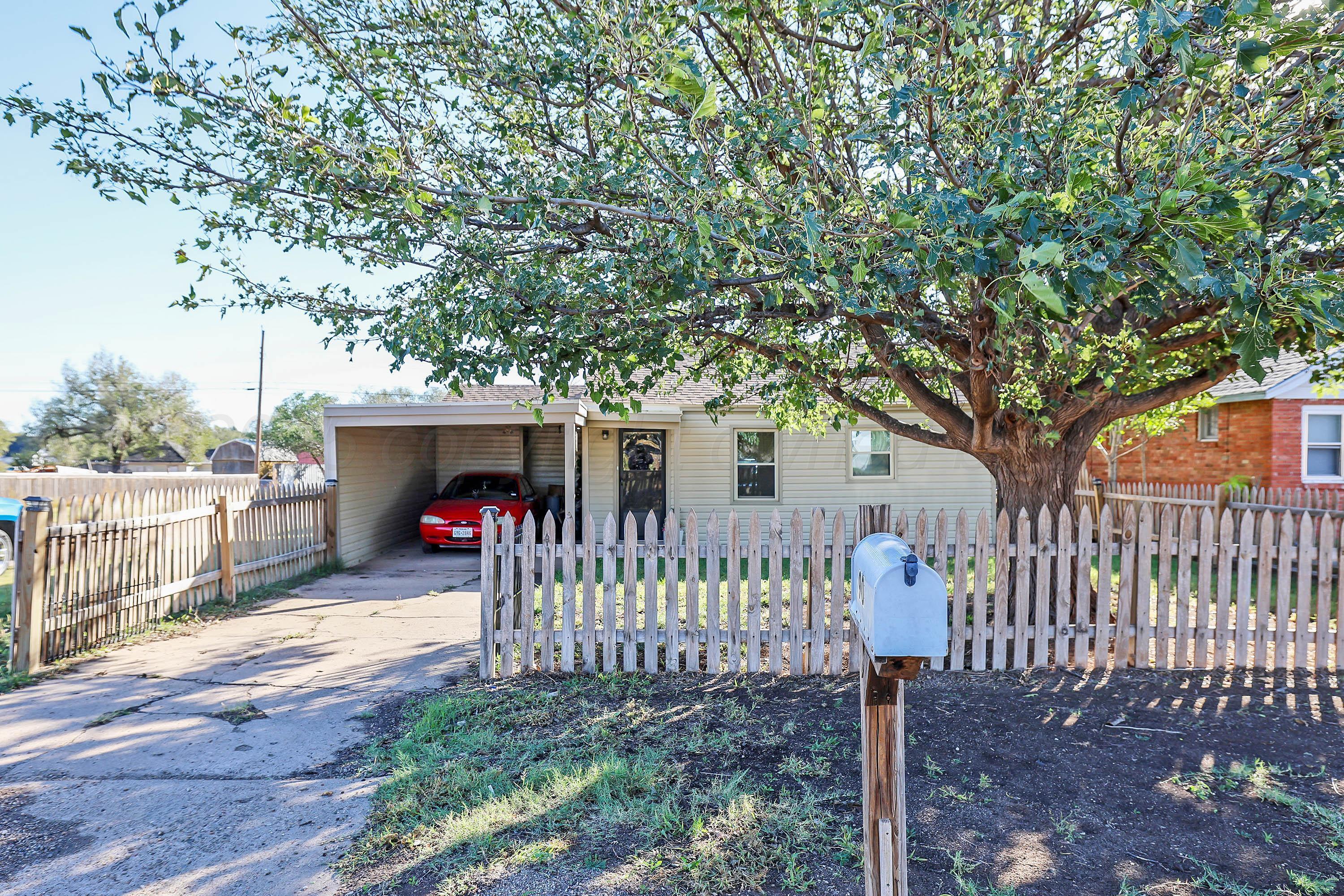 90 North Tennessee Street Amarillo, TX 79106 - Photo 2 of 22 a view of a house with a small yard and wooden fence