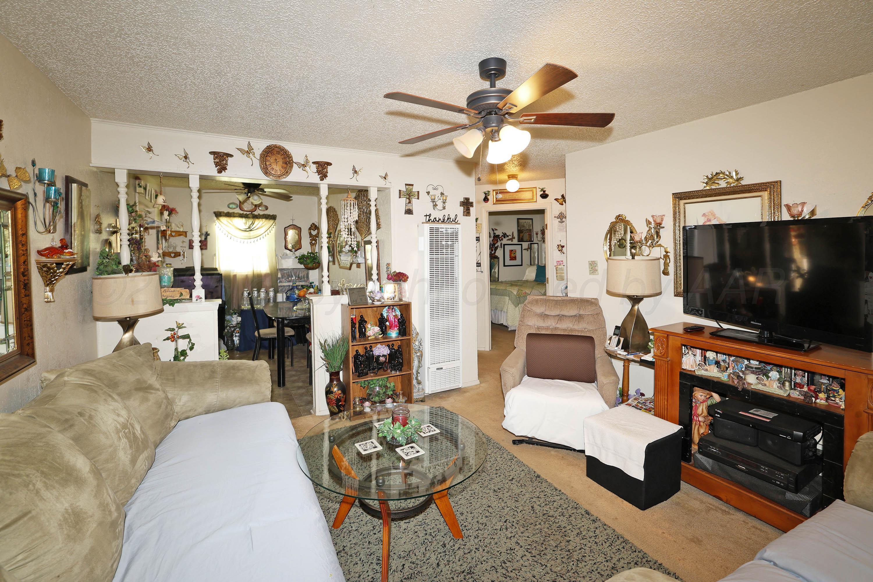 90 North Tennessee Street Amarillo, TX 79106 - Photo 5 of 22 a living room with furniture and a flat screen tv