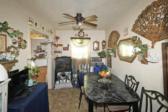 a view of a dining room with furniture and chandelier