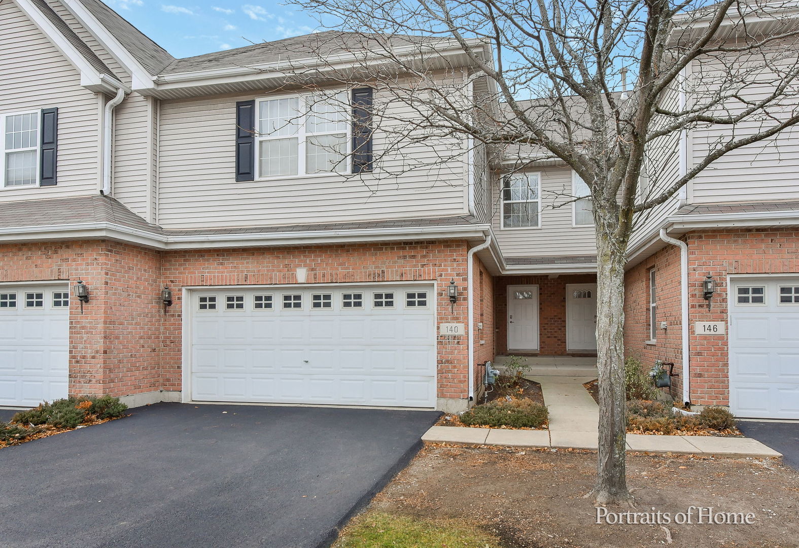 140 Auburn Hills Lane, Unit 6 Addison, IL 60101 - Photo 1 of 26 a front view of a building