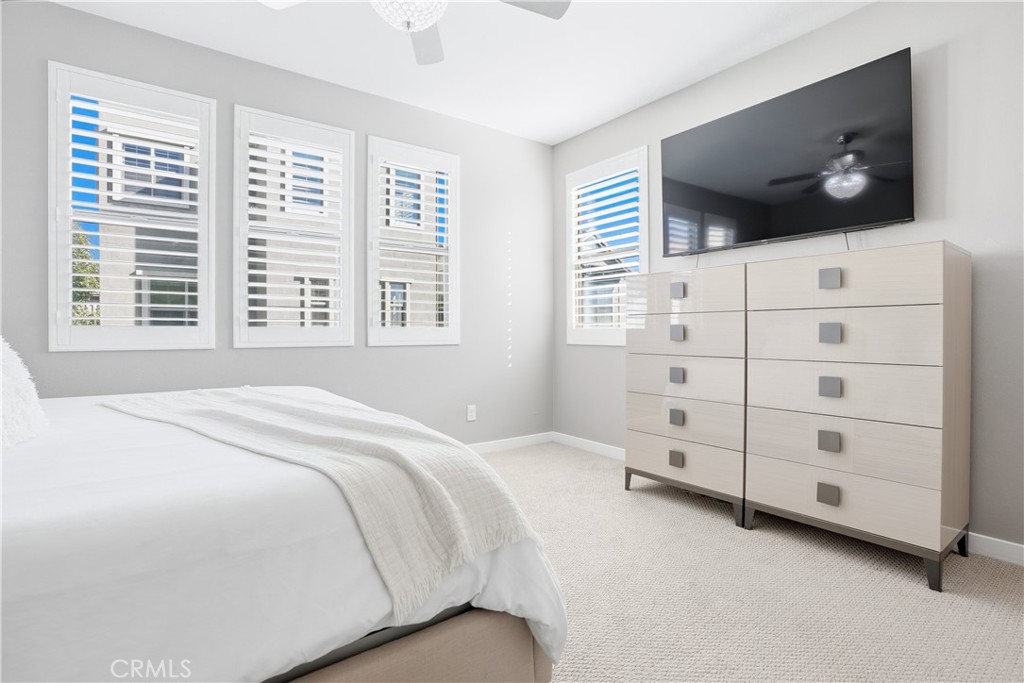 102 Marisol Street Rancho Mission Viejo, CA 92694 - Photo 23 of 75 a bedroom with a bed and a flat screen tv