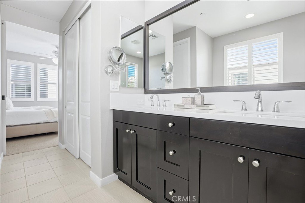 102 Marisol Street Rancho Mission Viejo, CA 92694 - Photo 26 of 75 a bathroom with a sink double vanity and a mirror