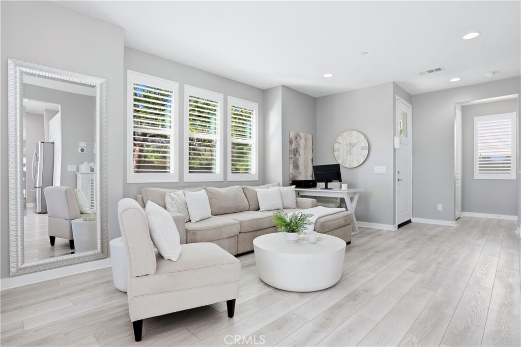 102 Marisol Street Rancho Mission Viejo, CA 92694 - Photo 8 of 75 a living room with furniture and wooden floor
