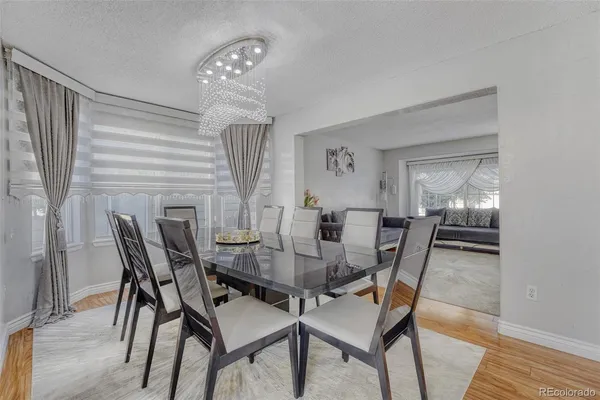 a dining room with furniture and window