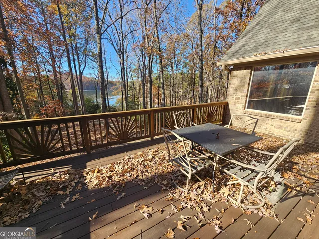 a balcony with furniture and wooden floor